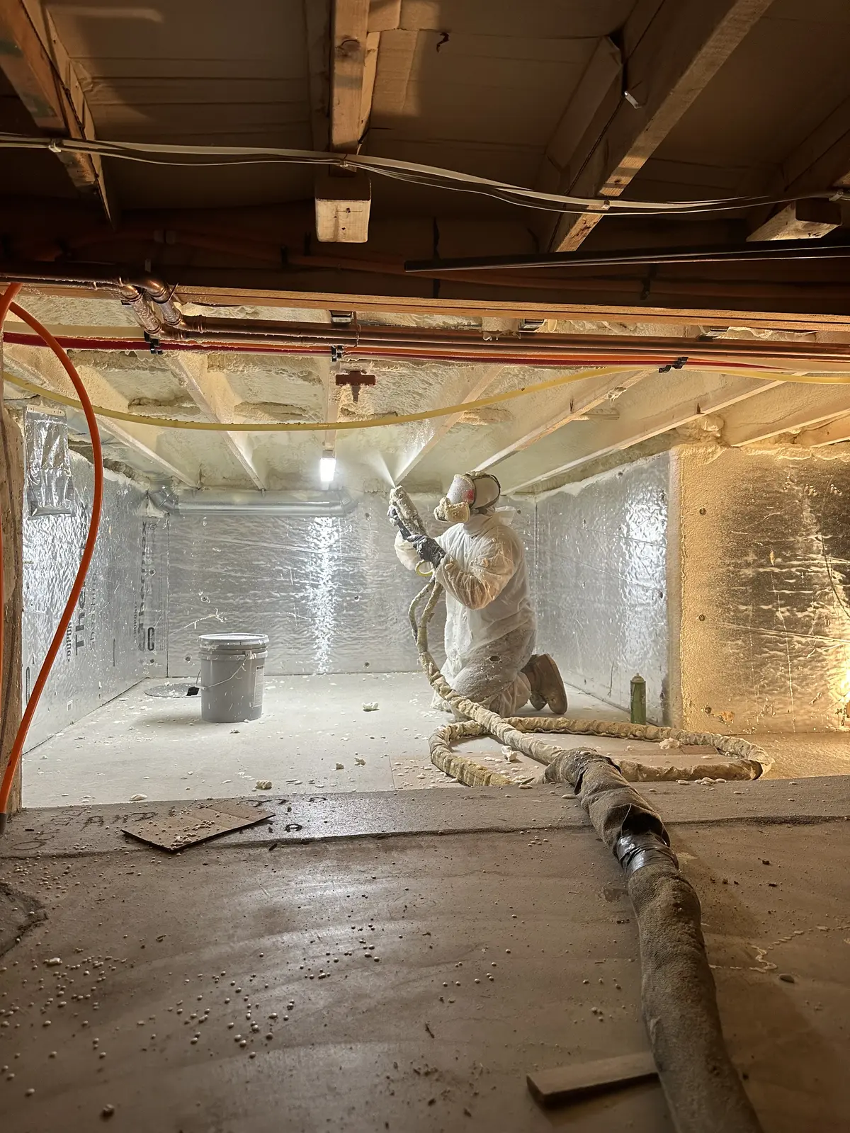 Spray foam insulation being applied